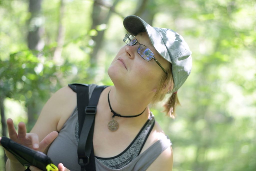 Amanda Bunce, a graduate student in the Department of Natural Resources, inventories trees within the UConn Forest. (Tom Rettig/UConn Photo)