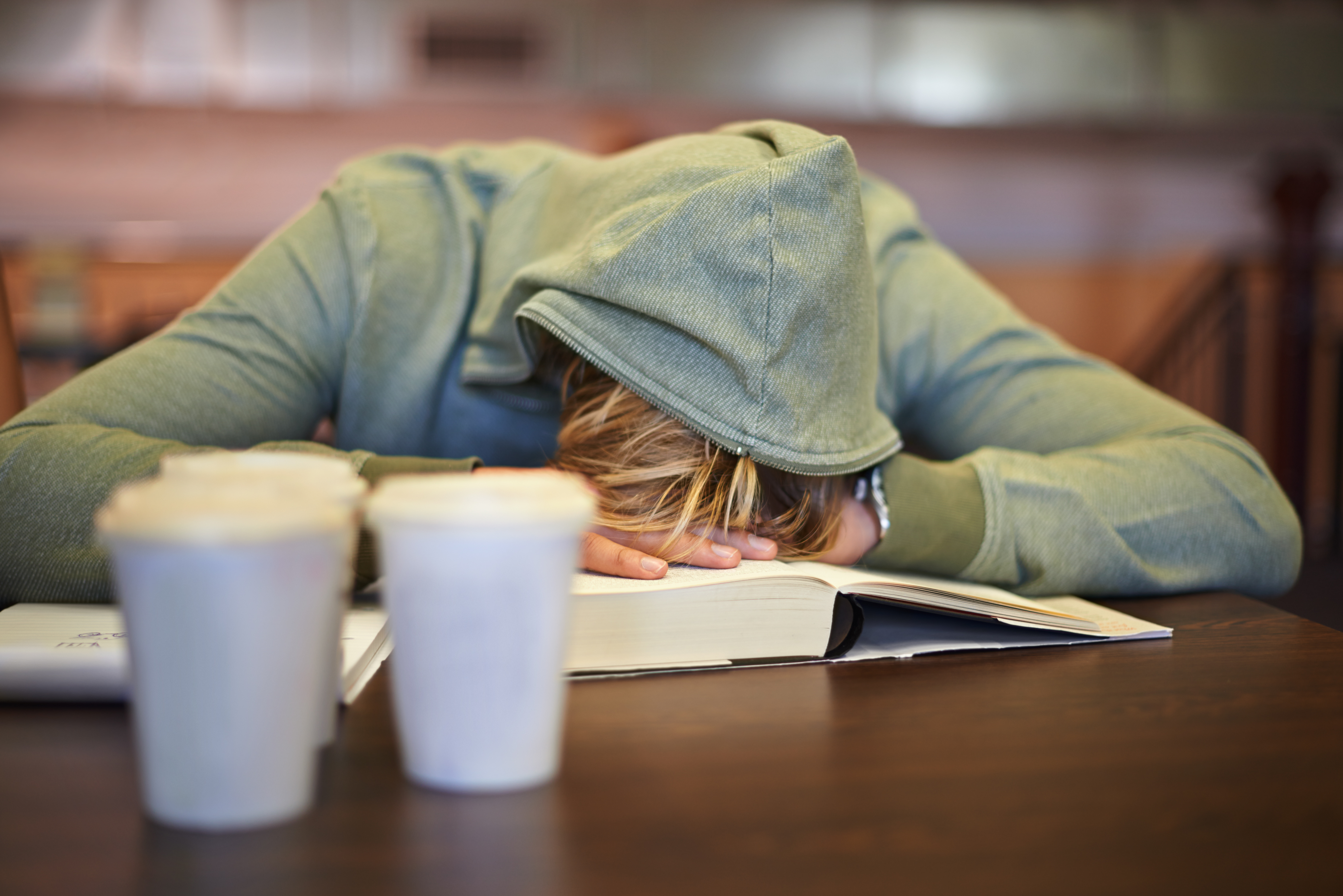 A young student asleep at school. (Getty Images)
