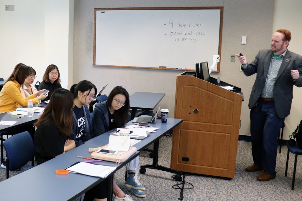 students from Southeast University in classroom with Professor David Woods at UConn School of Law