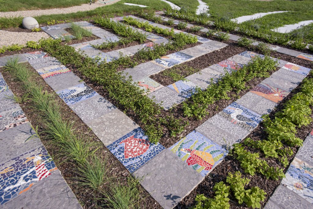 A maze of colored mosaic tiles at UConn Avery Point, part of the new cognitive garden at the campus