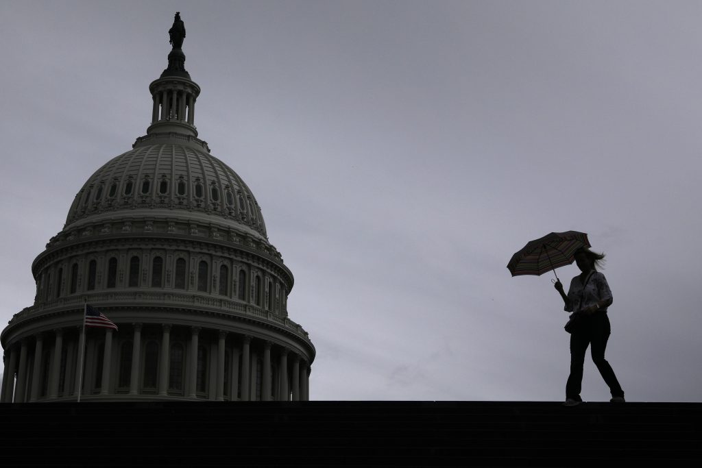 A view of the US Capitol building on a gray and stormy day
