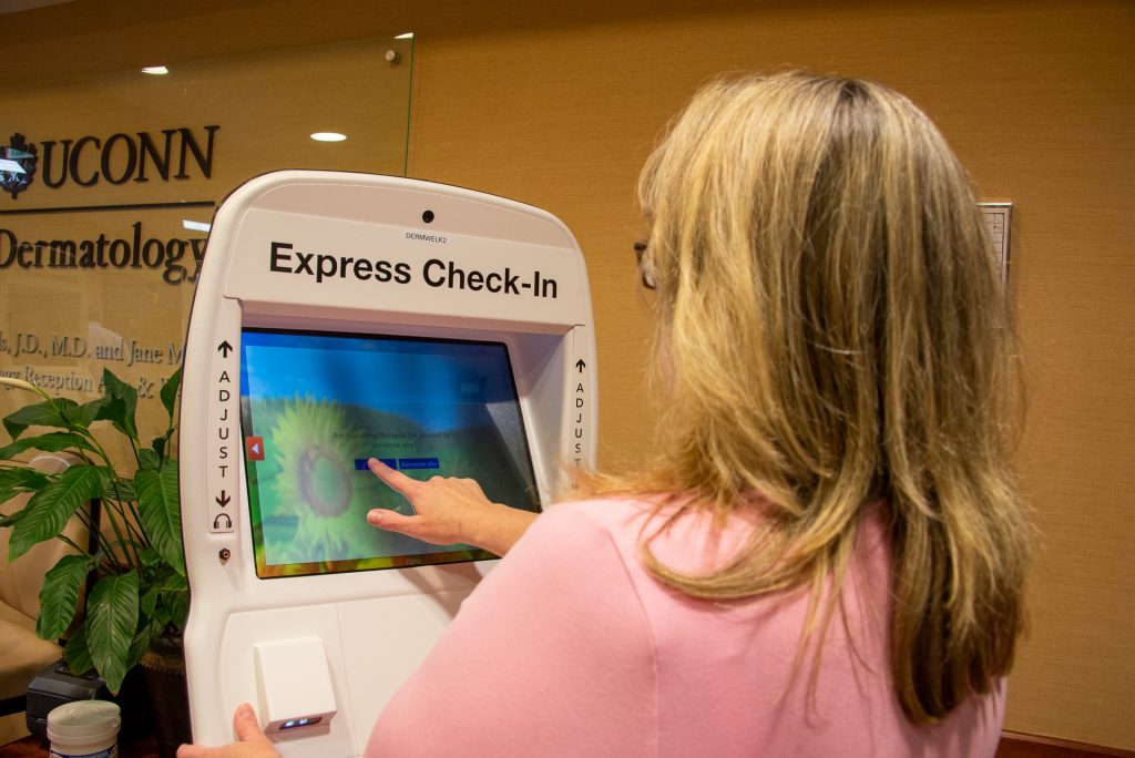 Woman using touch screen