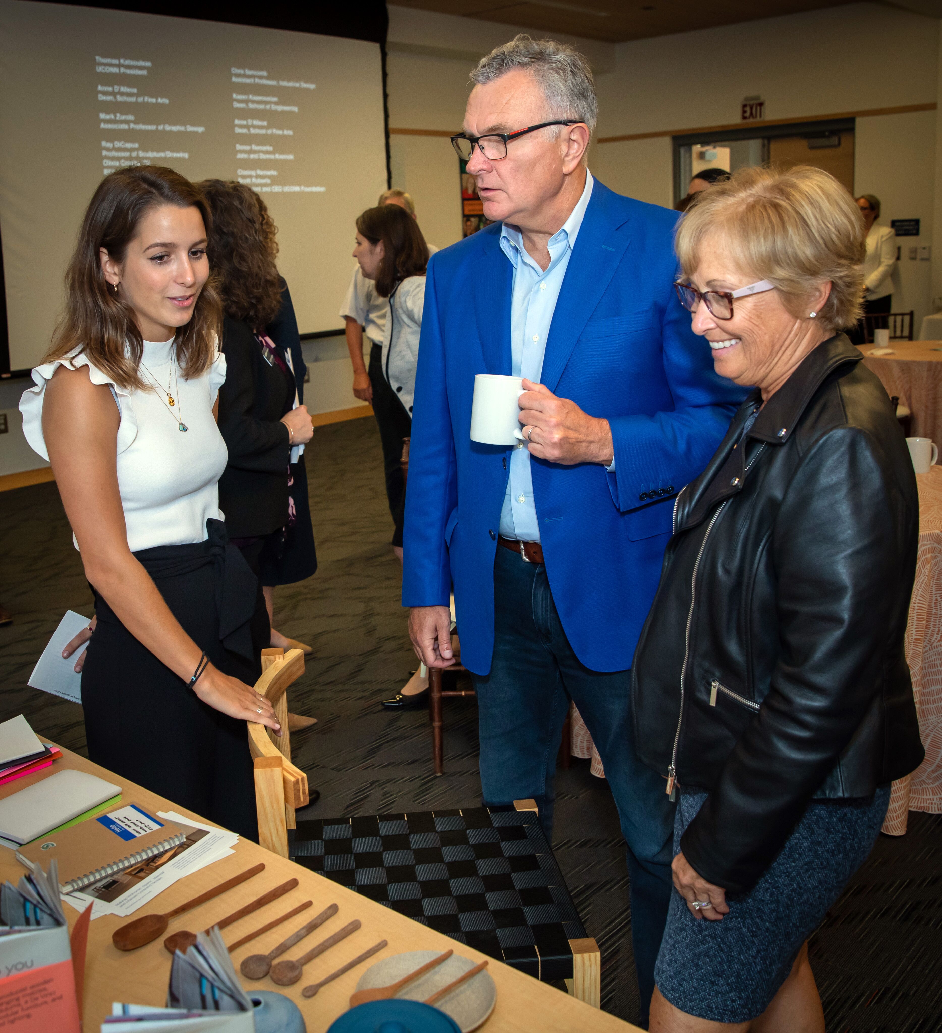 Following the announcement of their gift, John and Donna Krenicki hear from a student working at the intersection of the arts and engineering. (Gerry McCarthy/UConn Photo)