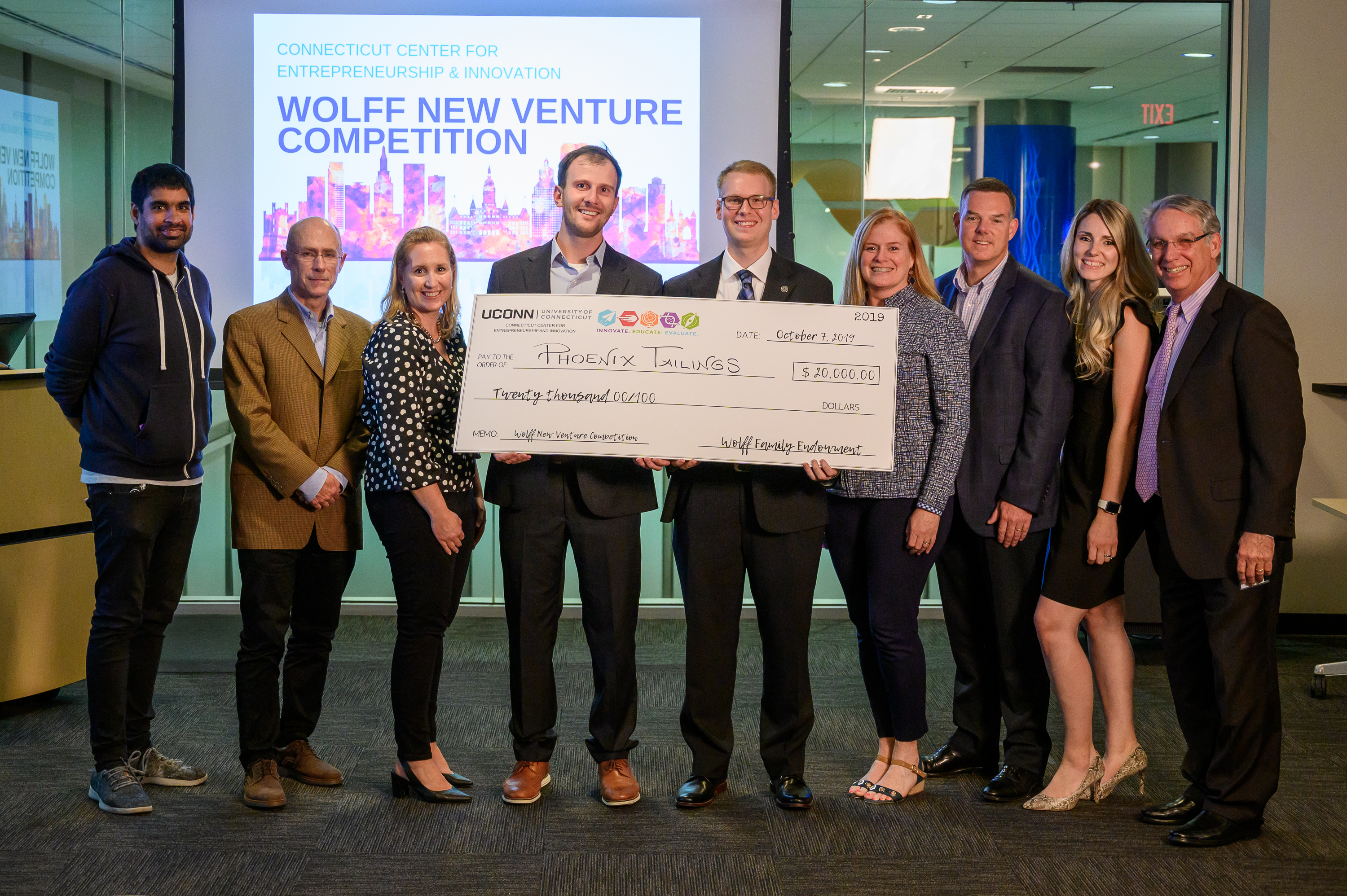Phoenix Tailings, the group that won the 2019 Wolff New Venture Competition, poses for group photos with the judges.