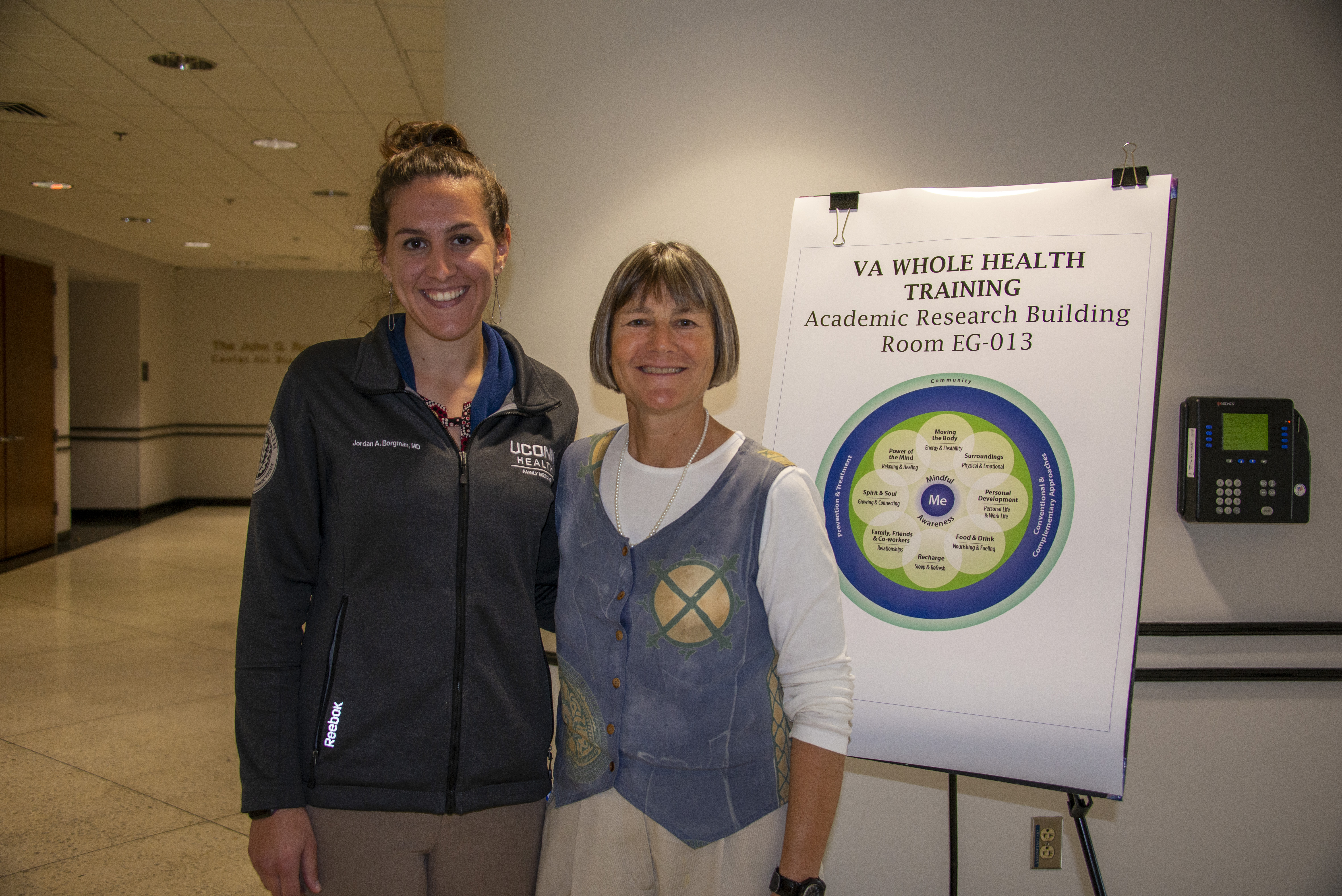 Drs. Jordan Borgman and Mary Guerrera with the Whole Health Wheel