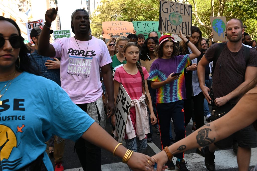 Teen climate activist Greta Thunberg walks with protesters during the Global Climate Strike march in New York September 20. Crowds of children skipped school to join a global strike against climate change, heeding the rallying cry of Thunberg and demanding adults act to stop environmental disaster. It was expected to be the biggest protest ever against the threat posed to the planet by climate change. (Timothy A. Clary/AFP/Getty Images)