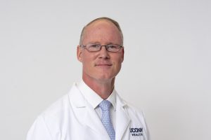 Dr. Kevin Becker portrait white coat