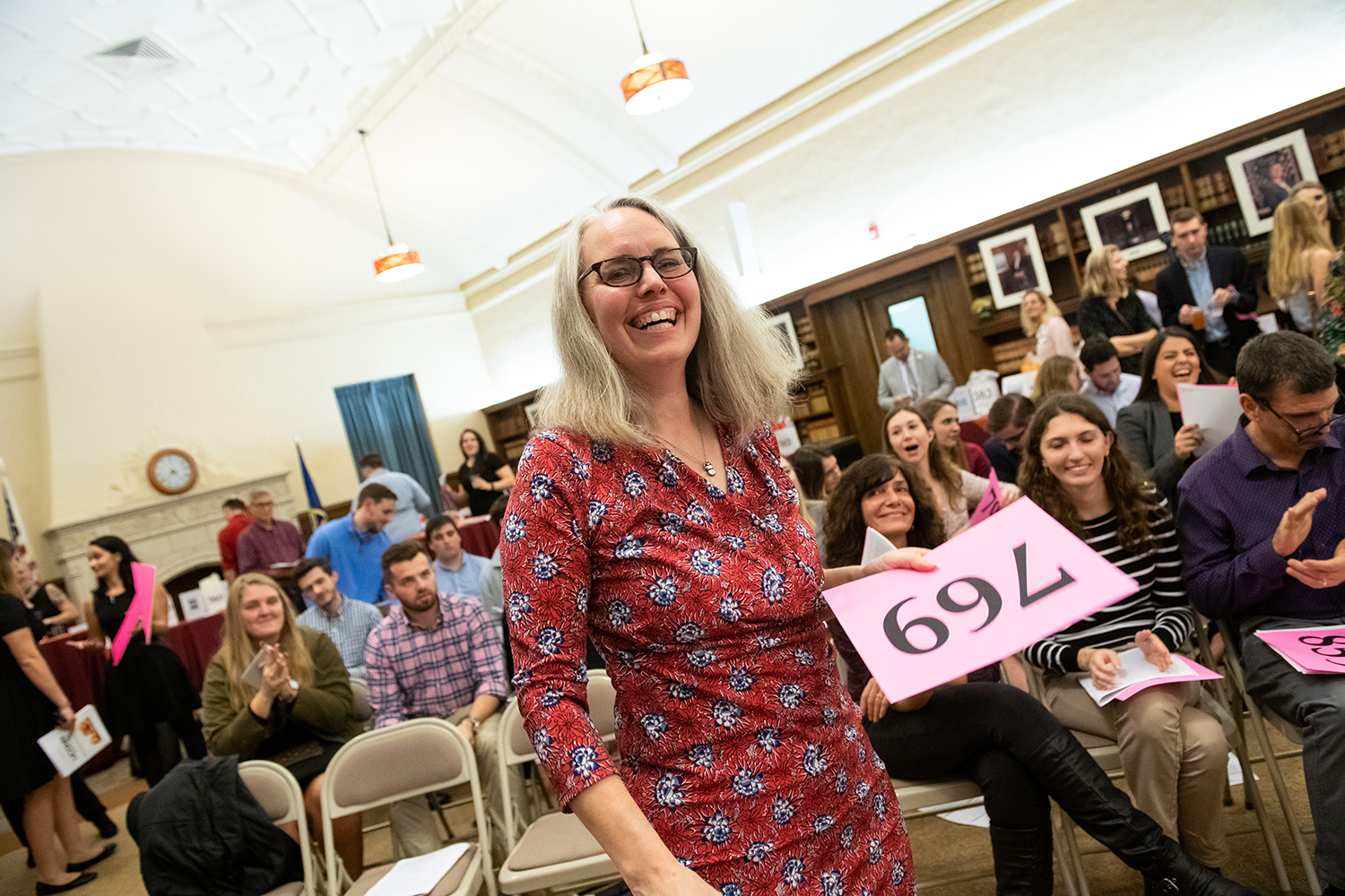 bidders at UConn Law PILG Auction