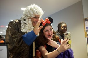 President Tom Katsouleas, wearing an Issac Newton costume participates in Halloween trick or treating at the Student Union on Oct. 31, 2019. (Peter Morenus/UConn Photo)
