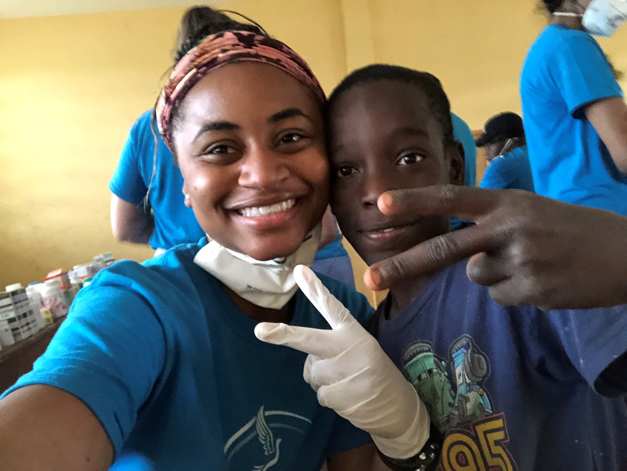 A selfie of Maia Moscova and a young patient at a health clinic in Haiti.