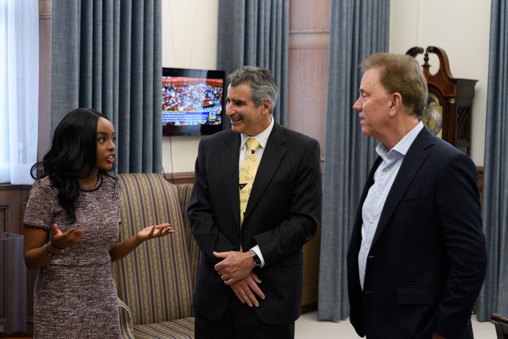 UConn Rhodes Scholar Wawa Gatheru talks with President Katsouleas and Governor Lamont at the State Capitol.