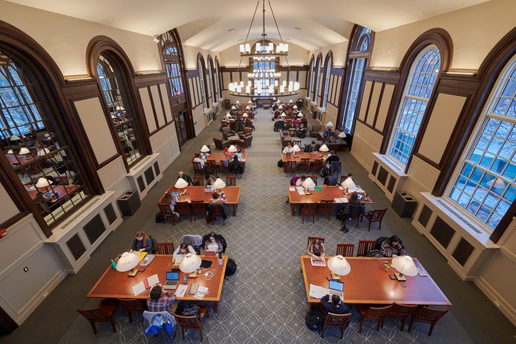 Students studying in the Wilbur Cross South Reading Room.
