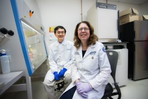 Researchers Se-Jin Lee and Emily Germain-Lee pose together in their lab.