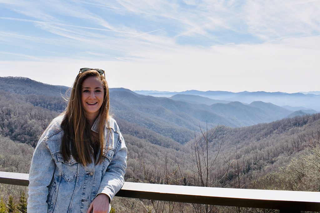 Michelle Wax '12 (BUS) poses for a photo in front of the Great Smoky Mountains in Tennessee. (Contributed Photo)
