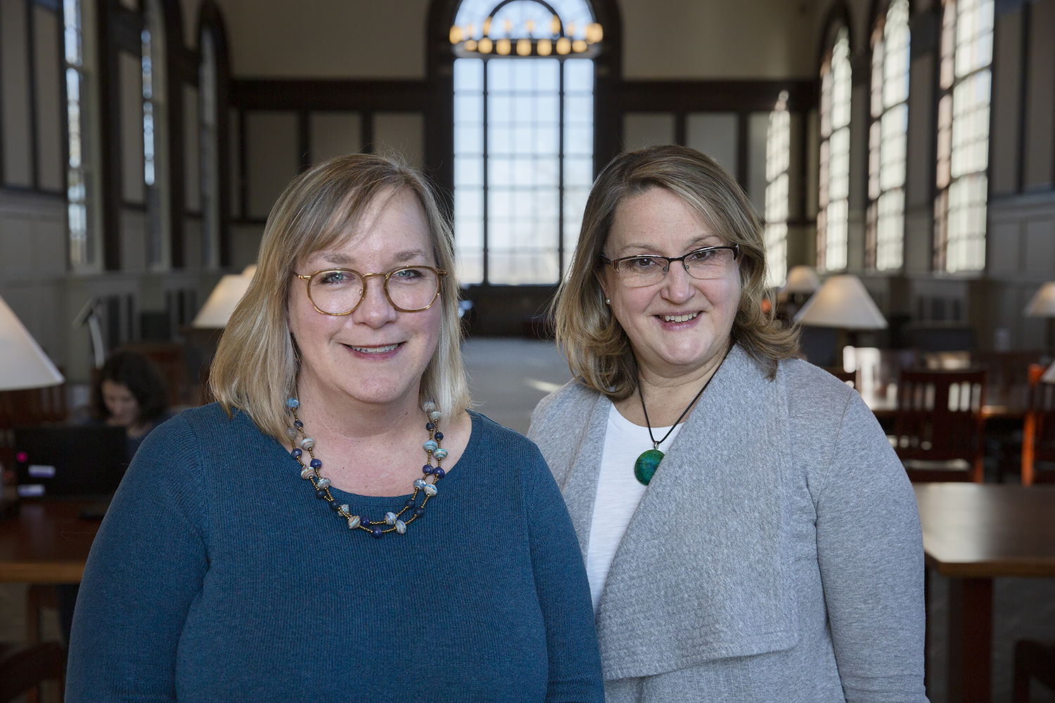 Katharine Capshaw and Lisa Park Boush stand together in the Wilbur Cross Building