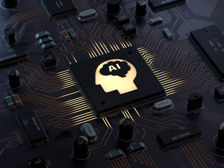 A circuit board with a graphic if a person's profile with AI in the middle.