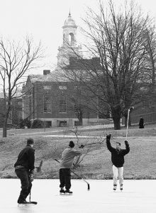 Students Chris Todisc, Jeff Benz and Eric Sanderson play hockey on Swan Lake in 1997. (David Ruddy/UConn File Photo)