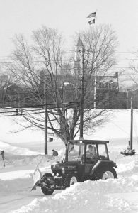 Dennis Kaba of UConn Facilities plows snow the morning after a blizzard in 1996. (UConn File Photo)