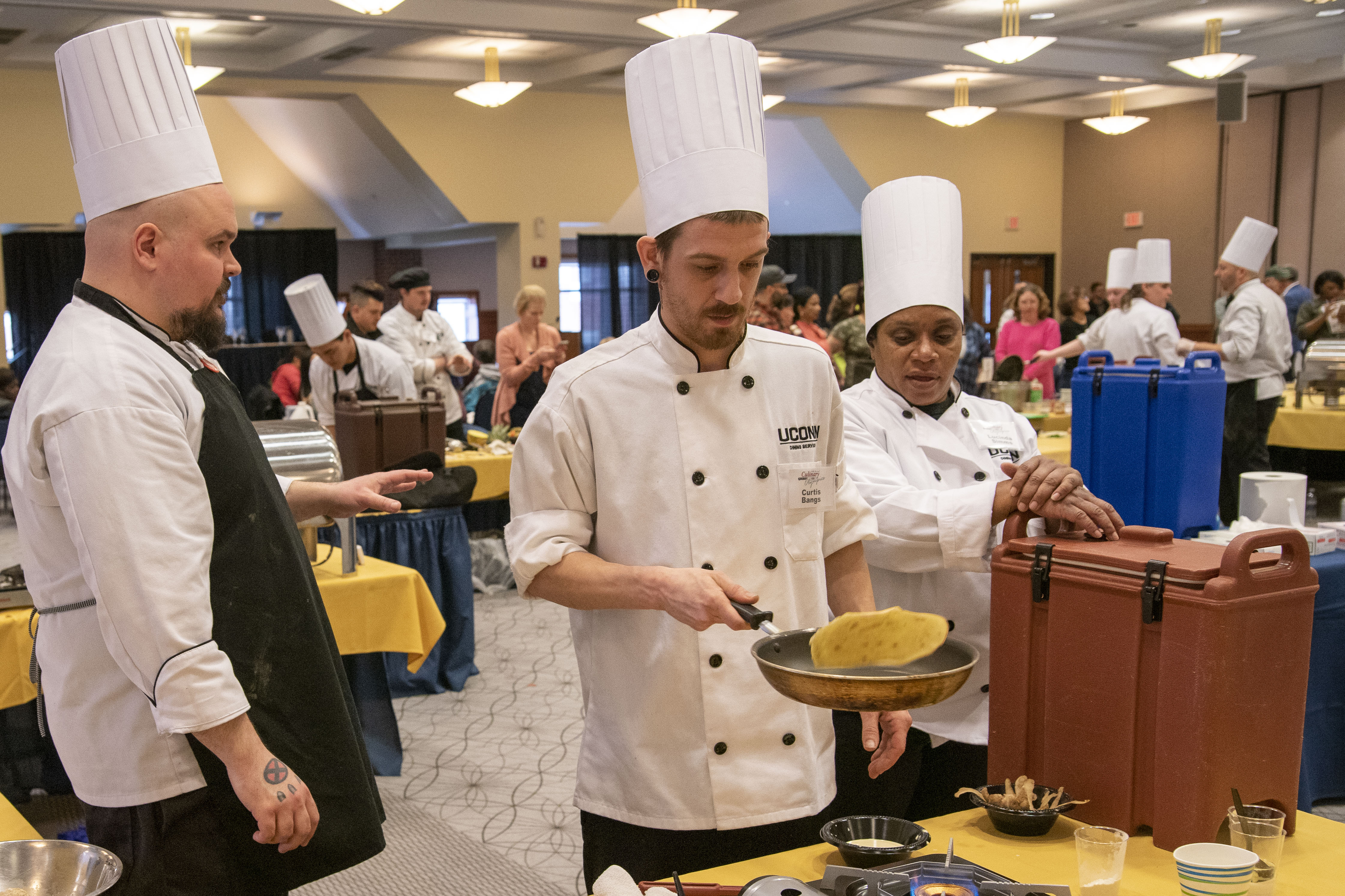 A chef makes a pancake at hte Boiling Point competition during the annual Culinary Olympics.