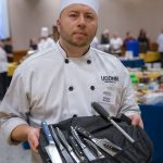 Chef Edgar Alzate showing tools of the trade during the Culinary Olympics on Jan. 14, 2020. (Sean Flynn/UConn Photo)