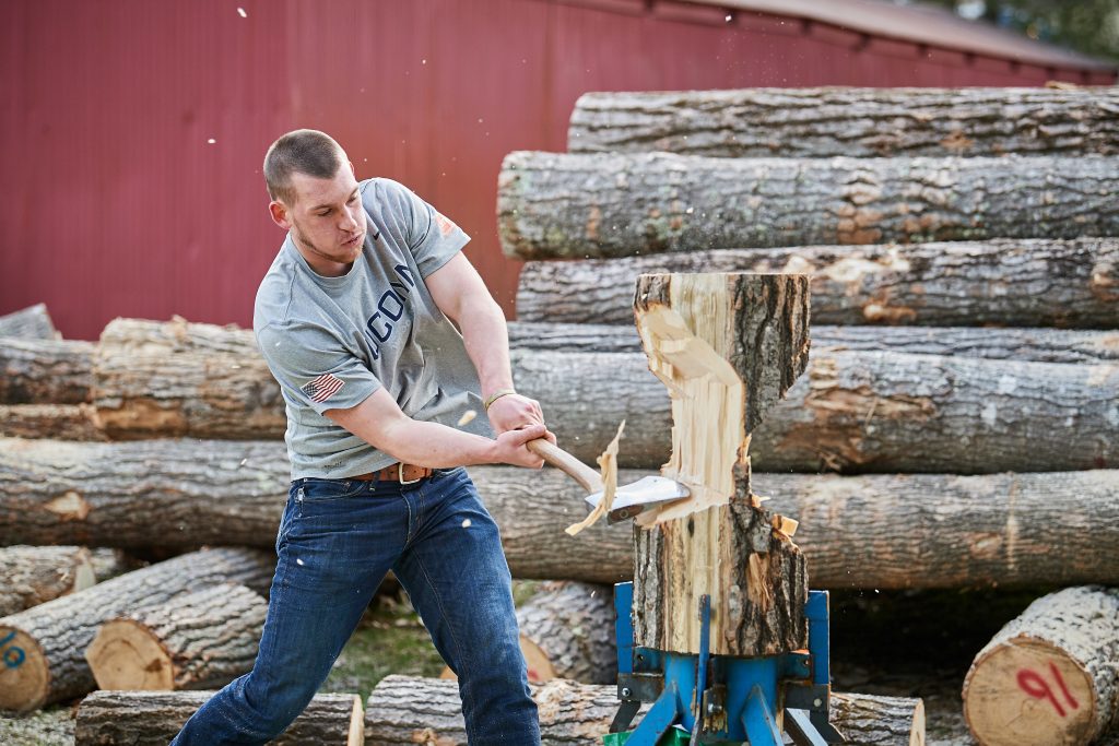 a man chopping a log