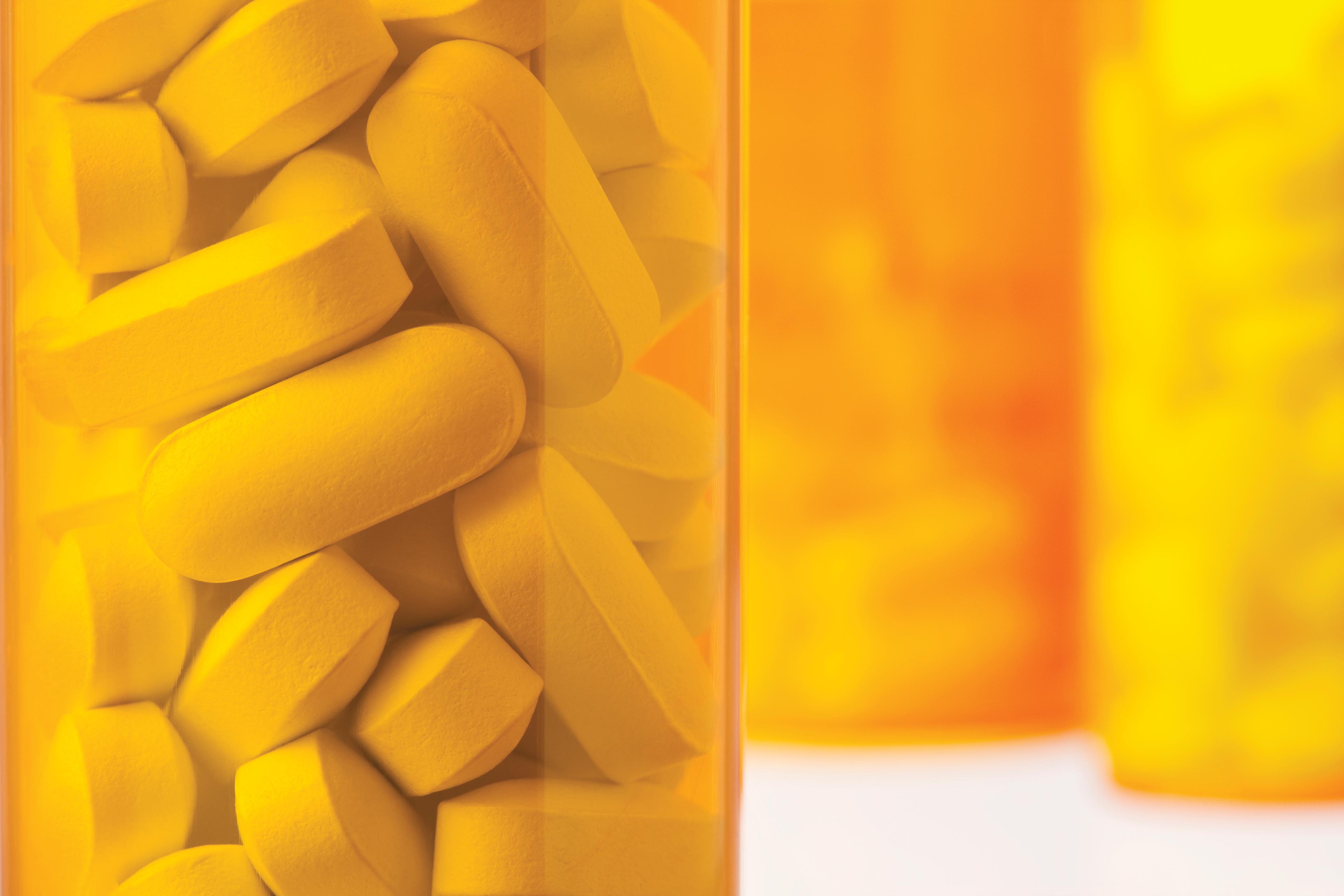 pills in a yellow bottle