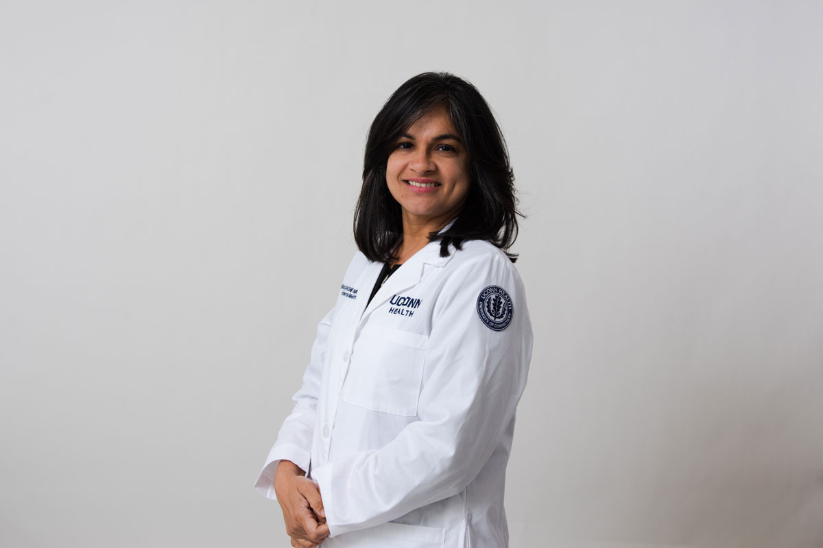 Dr. Varalakshmi Niranjan posing in profile.