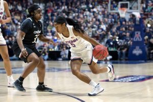 UConn guard Crystal Dangerfield drives to the hoop during UConn's victory in the AAC tournament final on Monday. (Stephen Slade / UConn Athletic Department)