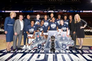 The victorious Huskies pose after winning their seventh straight AAC tournament championship. (Stephen Slade / UConn Athletic Department)