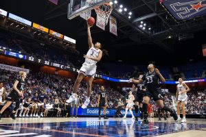 UConn forward Megan Walker takes it to the hoop during UConn's victory in the AAC tournament final on Monday. (Stephen Slade / UConn Athletic Department)