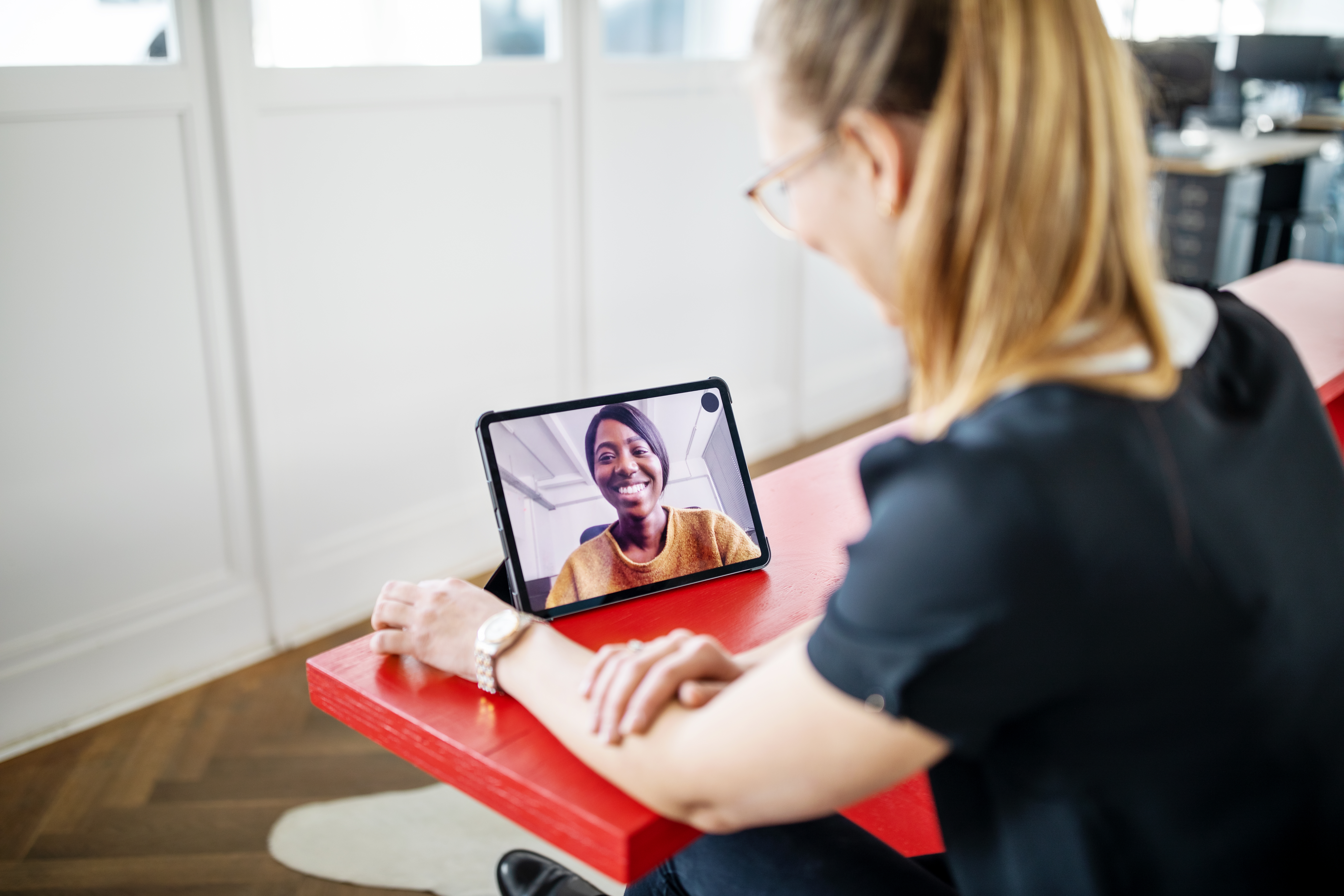 Two women talking via videoconference.