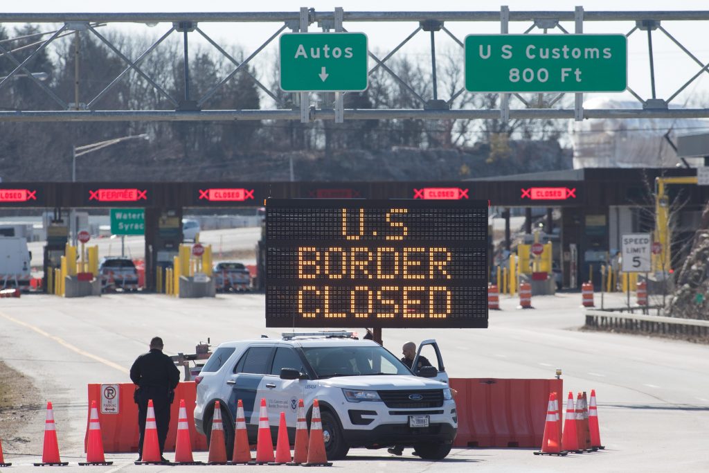 An electronic sign reading "US Border Closed" at the country's border with Canada.