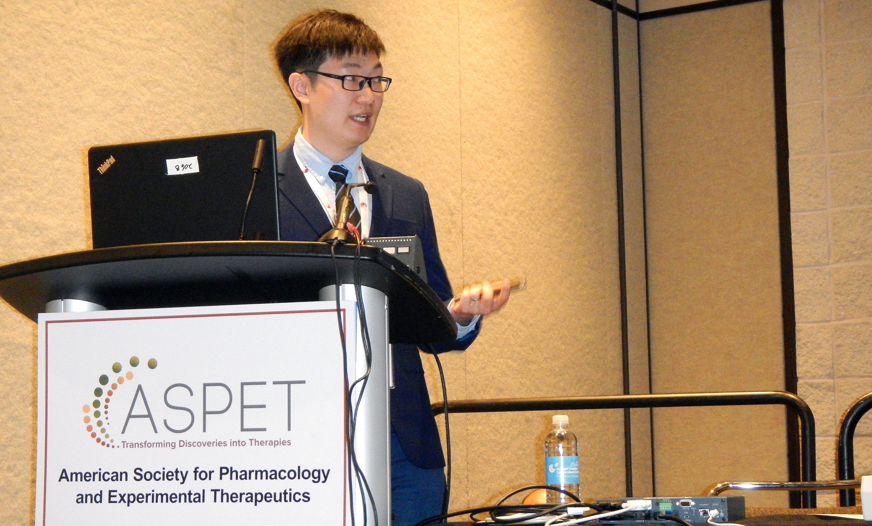 Liming Chen gives oral presentation at an ASPET meeting