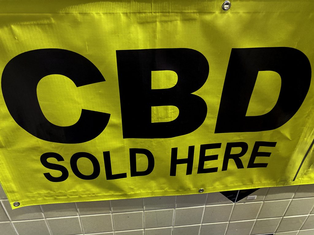 A sign advertising CBD oil for sale.