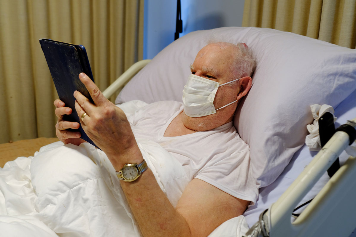 Older inpatient using tablet