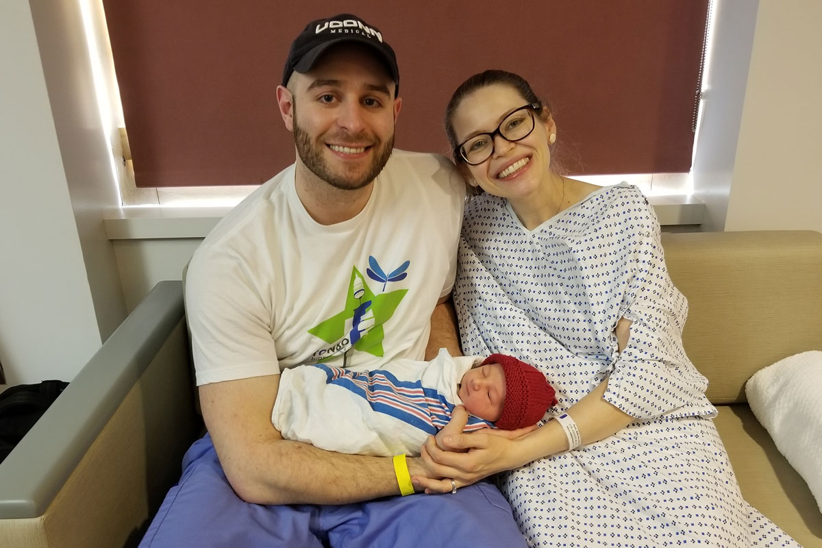 Parents with their newborn in labor and delivery