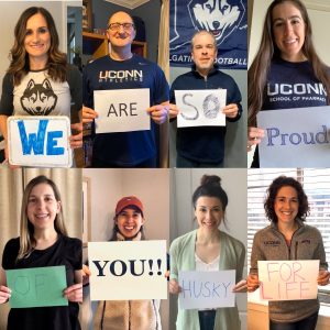 8 UConn Pharmacy faculty hold up sign in video to students