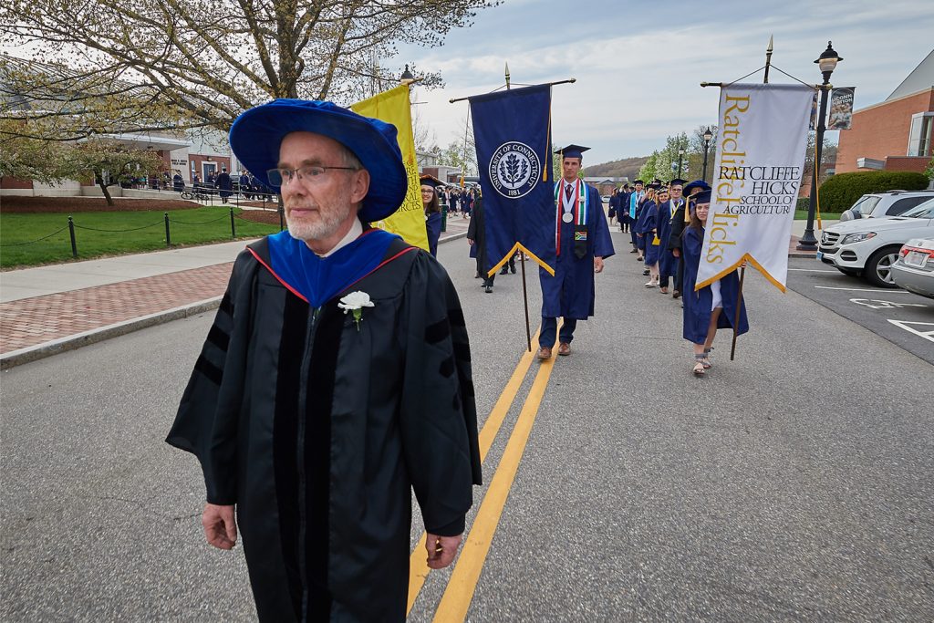 Hedley Freake leads the banners during the College of Agriculture, Health and Natural Resources Commencement procession