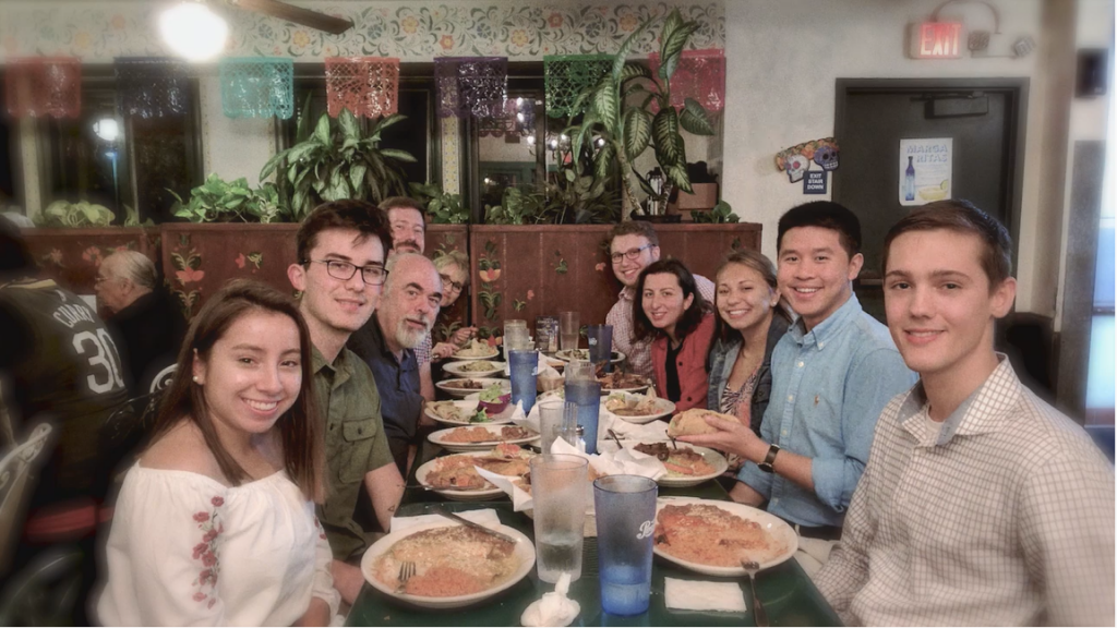 A photo featuring a member of the Class of 2020 and her family at a restaurant.