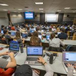 Students listen to a lecture by Professor Anna Radziwillowicz in the School of Business on Sept. 6, 2017. (Sean Flynn/UConn Photo)