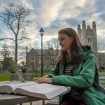 Studying outdoors at the School of Law on Dec. 5, 2016. (Sean Flynn/UConn Photo)