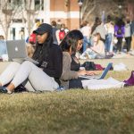 Students enjoying a unusually warm winter day on the Student Union Mall on Feb. 21, 2018. (Sean Flynn/UConn Photo)