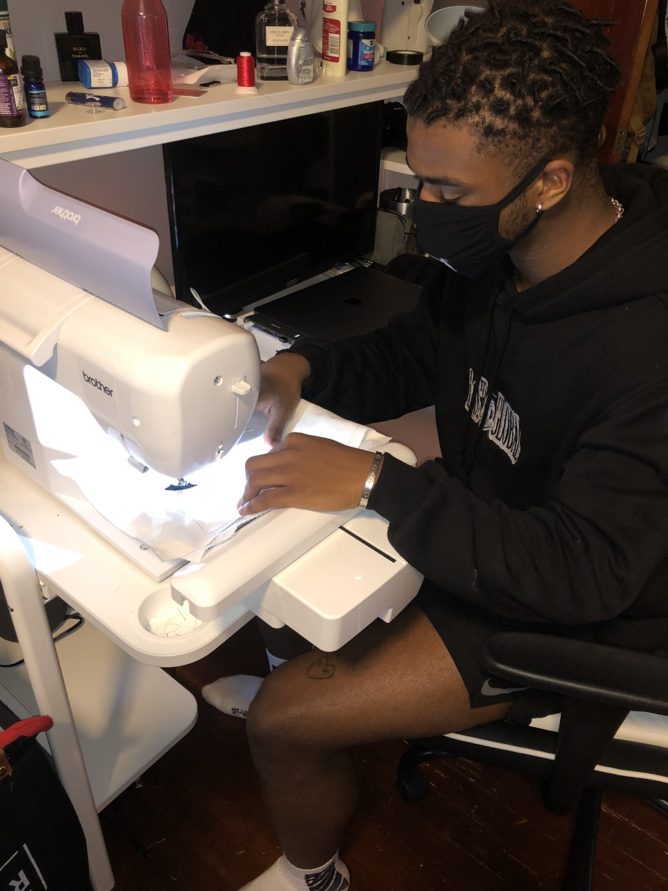 Ahmed Diakhate, a UConn Stamford student, sews masks for health care workers.