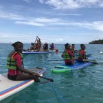 A group of young children in the Dominican Republic using paddle boats in the open ocean. (Photo courtesy of Tony Garcia)