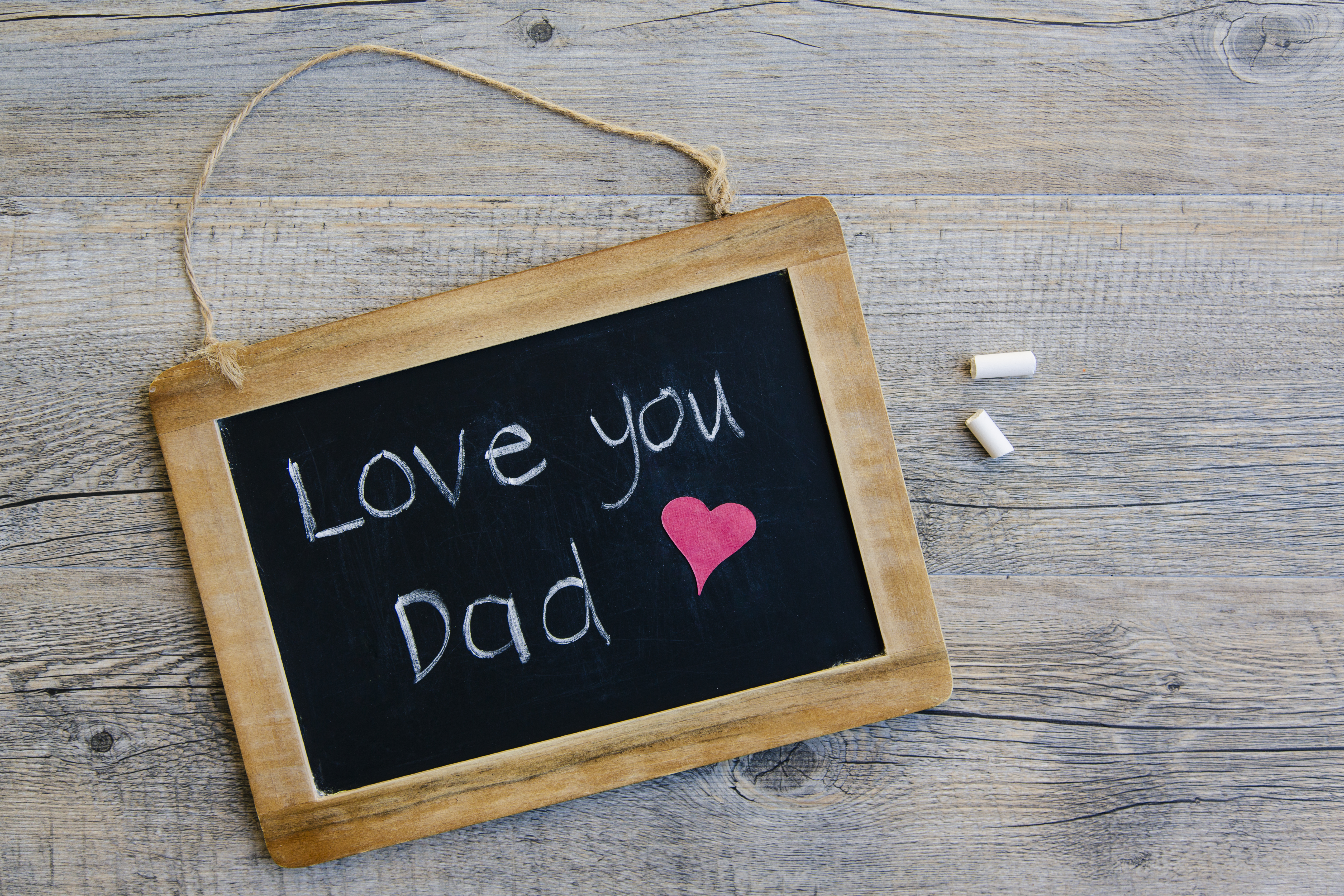 A message of 'love you Dad' on a blackboard written by a child for Father's Day.