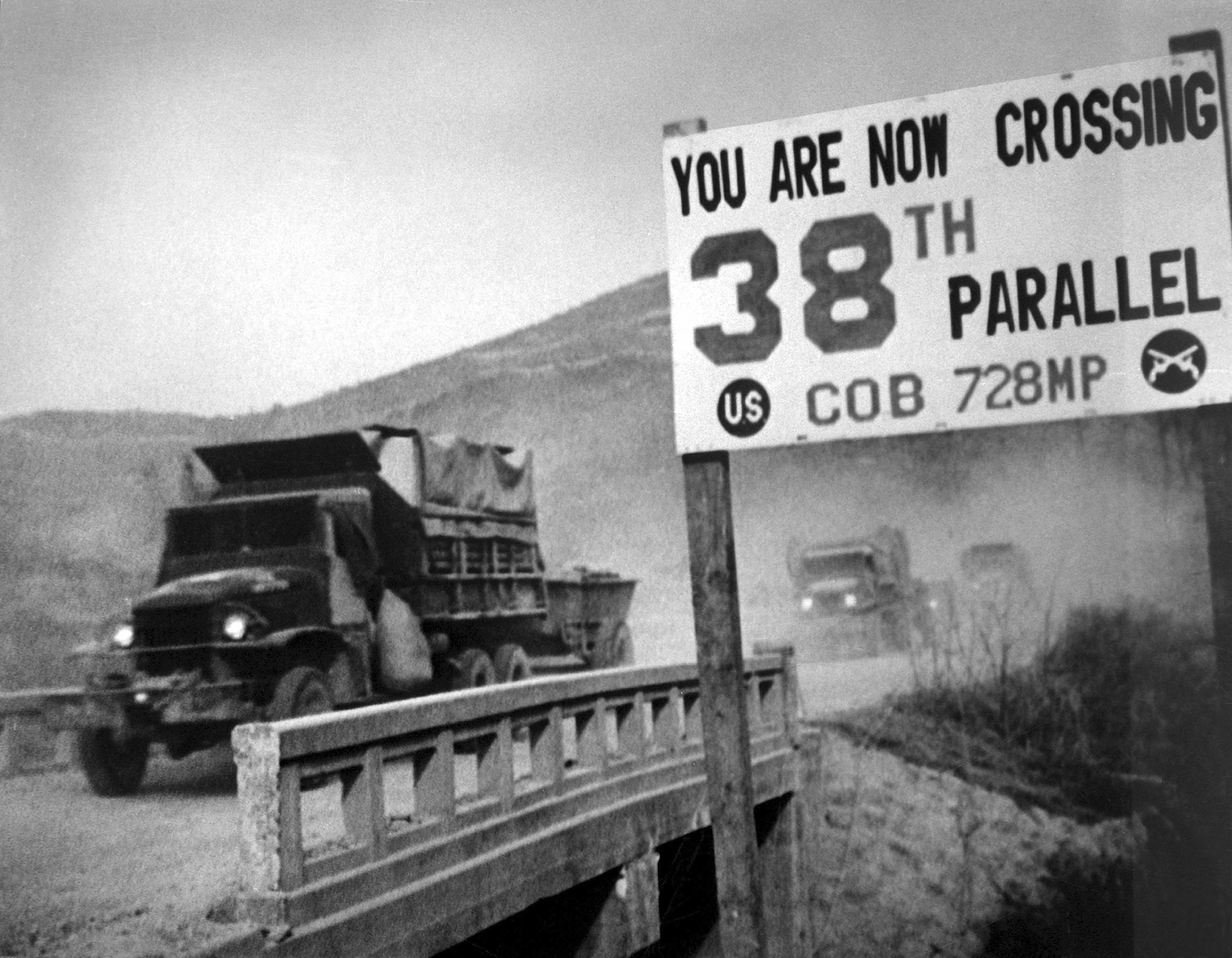 View of United Nations forces, traveling in trucks, crossing the 38th parallel as they withdraw from Pyongyang, the North Korean capital, 1950. (Photo by Interim Archives/Getty Images)