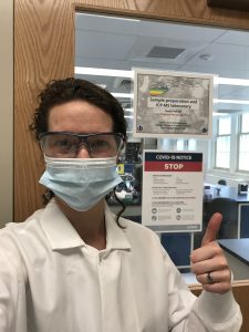 Julie Fosdick, assistant professor of Geosciences, pictured at her lab wearing a newly-required face mask (Photo by Julie Fosdick)