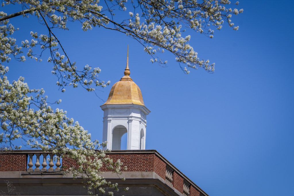 The golden cupola of the Wilbur Cross building on a spring day.