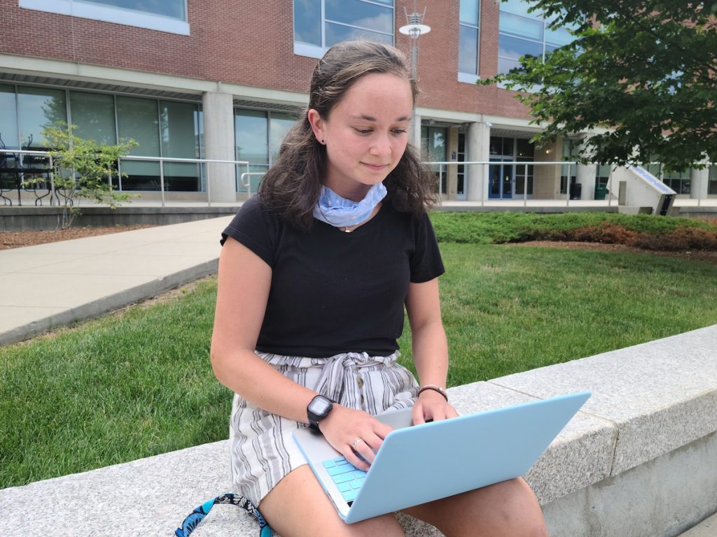 a student sitting on a bench