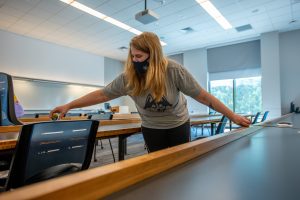 Workers prepare classrooms for the era of social distancing (Sean Flynn/UConn Photo)